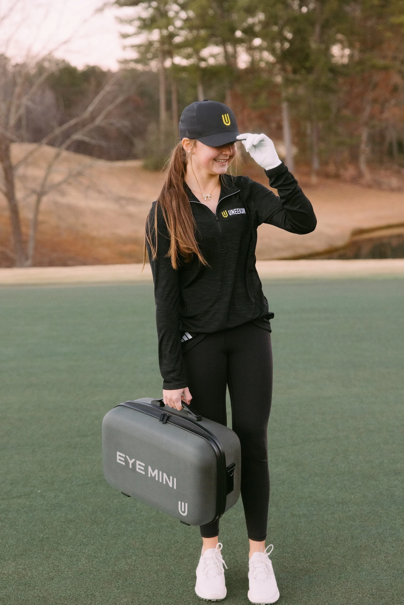 Young girl with Uneekor baseball cap